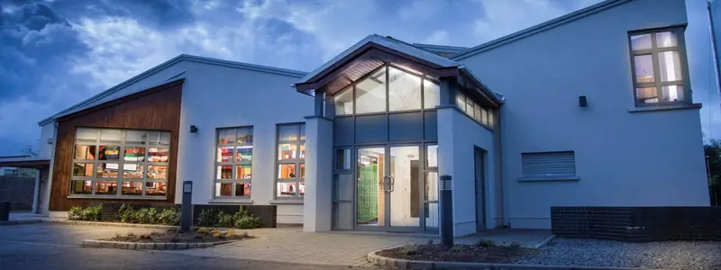 The St Peter's Dunboyne clubhouse on the Rooske Road, lit up at dusk