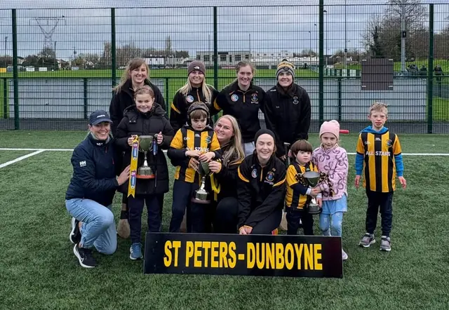 The Dunboyne All Stars with members of the Leinster-winning camogie team and their cups