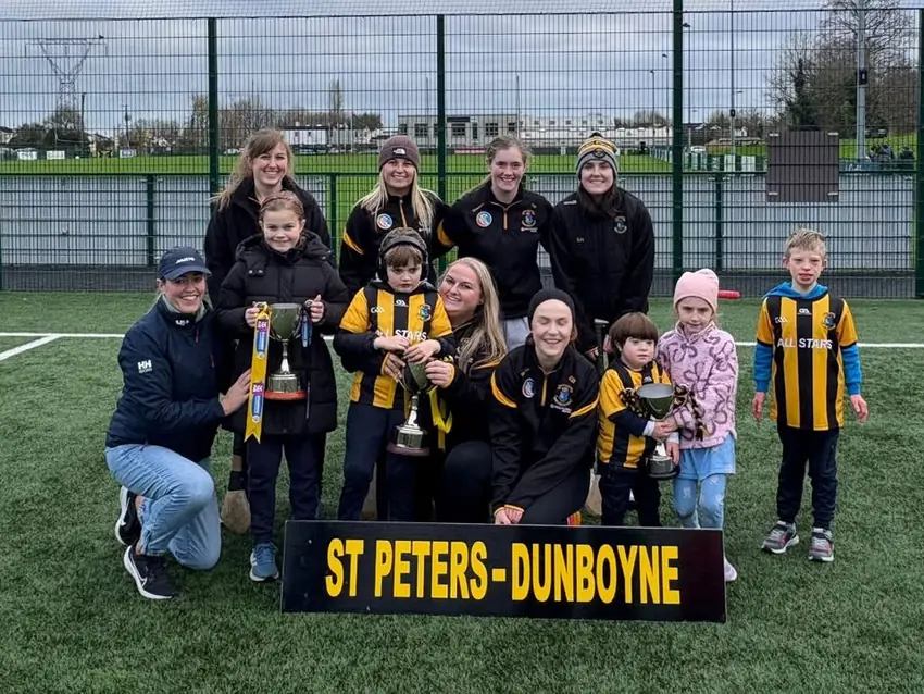 The All Stars with members of the Leinster-winning camogie team and their cups