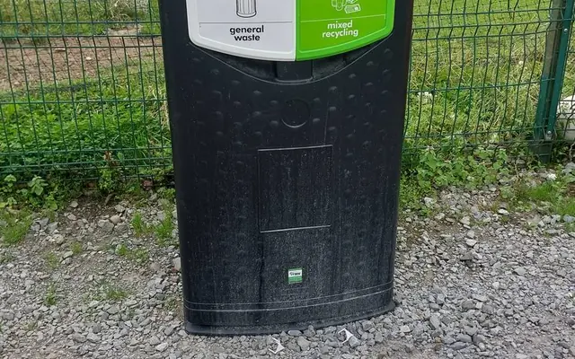 External recycling bins beside the pitches