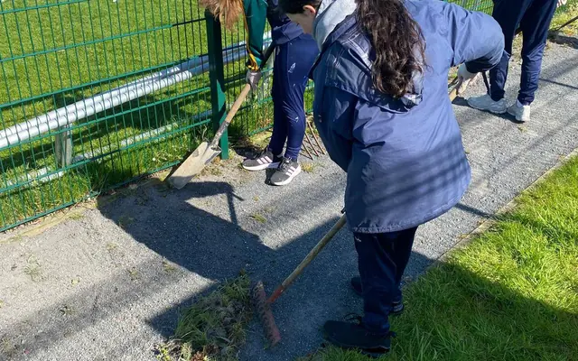 Students helping to tidy the grounds